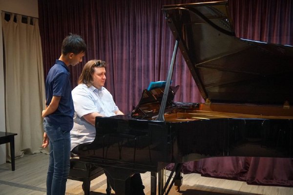 Dr Krystian Tkaczewski playing piano at Tanglewood Music School Bukit Timah