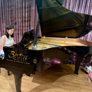 Young Lady Playing on a Grand Piano