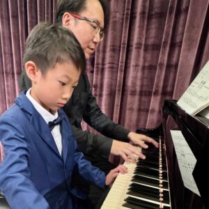 Young player with his teacher