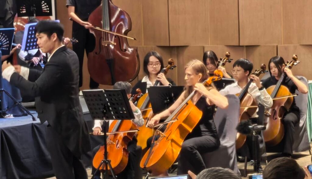 Students performing on stage during music recital at Tanglewood Music School Bukit Timah.